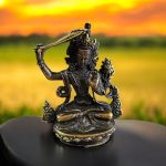 Embrace the wisdom of Tibetan Buddhism with this handmade Manjushri statue, crafted by skilled artisans in Nepal. A cherished companion on your spiritual journey.