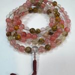 Handmade in Nepal by skilled artisans, this natural mountain quartz mala supports your meditation practice, fostering clarity, focus, and a harmonious connection with the universe.