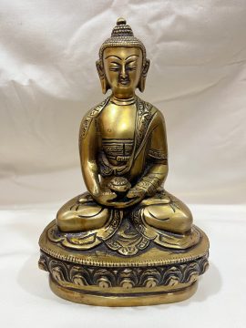 This handmade Amitabha Statue, crafted by skilled artisans in Nepal, embodies compassion and wisdom, serving as a spiritual focal point and inviting blessings into your space.
