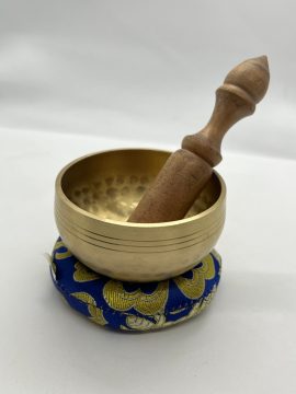 This handmade brass singing bowl from Nepal is a cherished companion for meditation, inviting tranquility and spiritual connection through its harmonious vibrations.
