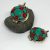 The gau, a sacred prayer box pendant, is handmade in Nepal by skilled artisans, serving as a portable shrine that connects the wearer to their spiritual journey.