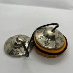 Handmade in Nepal by skilled artisans, these tingsha bells of sacred metals produce harmonious sounds, enhancing meditation and rituals while embodying the eight auspicious symbols of Buddhism.