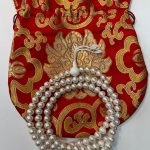 Handmade in Nepal by skilled artisans, this Tibetan Buddhist Pearl Mala embodies feminine energies, supporting purity and wisdom on your spiritual journey, while enhancing your meditation practice.