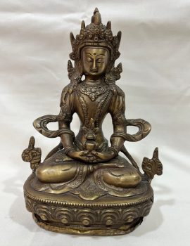 This handmade Amitayus Statue, crafted by skilled artisans in Nepal, symbolizes longevity and wisdom, featuring a hidden compartment for sacred mantras to enrich its spiritual essence.