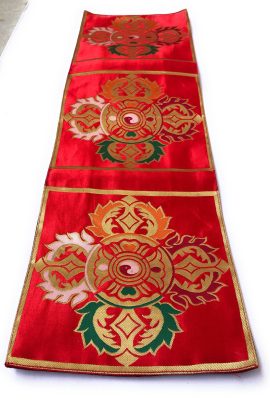 This handmade red double Dorje placemat from Nepal provides a sacred foundation for your meditation practice, enhancing your spiritual space with its rich Tibetan cultural significance.