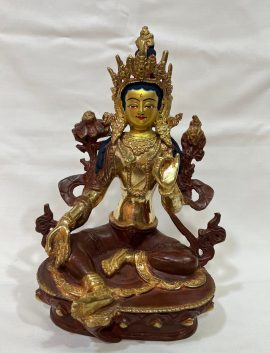 This handmade Green Tara statue, crafted in Nepal by skilled artisans, embodies compassion and determination, enhancing your spiritual space with its sacred presence.