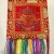 This handmade wall hanging from Nepal features the Eight Auspicious Symbols, embodying spiritual abundance and well-being, perfect for enriching any sacred space.