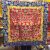 This handmade altar cloth, crafted in Nepal by skilled artisans, features auspicious symbols on rich red silk brocade, inviting serenity and cultural elegance to your sacred space.