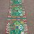 This handmade table runner, crafted in Nepal by skilled artisans, features a traditional double dorji design, symbolizing the indestructible nature of enlightenment, enriching your meditation space.