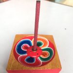 This handmade incense burner from Nepal features a lotus design, symbolizing purity and spiritual awakening, enhancing your meditative practices while collecting ash securely.