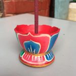 This handmade lotus-shaped incense burner from Nepal, crafted by skilled artisans, serves as a sacred vessel, purifying your space with the rising fragrant smoke during meditation or prayer.