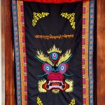 This handmade Mahakala door hanging, crafted in Nepal by skilled artisans, invites protective blessings and auspicious energies into your sacred space, enhancing your spiritual journey.