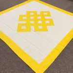 This handmade altar cloth, crafted by skilled artisans in Nepal, features the endless knot, symbolizing life's interconnectedness and enhancing the sacred atmosphere of your meditation space.