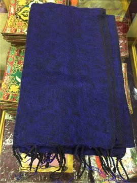 This handmade Tibetan blue yak wool meditation shawl, crafted by skilled artisans in Nepal, offers warmth and comfort, enhancing your meditation practice and fostering tranquility.