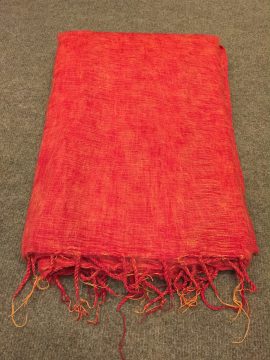 This orange yak wool meditation shawl, handmade in Nepal by skilled artisans, envelops you in warmth, enhancing your meditation practice with its comforting embrace and spiritual significance.