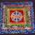 This handmade Tibetan altar cloth, crafted in Nepal, features a vibrant Wheel of Life design, enhancing your meditation space and enriching your spiritual practice.