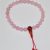 Handmade in Nepal, this Rose Quartz Hand Mala features 25 beads and a carnelian guru bead, promoting emotional balance and inner peace during prostration and travel.