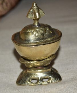 This handmade brass kapala from Nepal symbolizes the transformation of ignorance into wisdom, reflecting the impermanence of life in Vajrayana Buddhist practice.