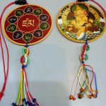 This handmade Zambala car hanging, crafted by skilled artisans in Nepal, embodies a talisman of protection and prosperity, inviting good fortune wherever it is placed.