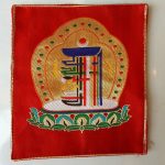 This Kalachakra Red Small Placemat, handcrafted in Nepal by skilled artisans, creates a sacred space for your spiritual practice, embodying the essence of Tibetan culture and devotion.