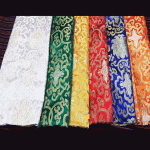 This handmade Tibetan silk brocade from Nepal features a lotus design, embodying the essence of Vajrayana Buddhism and enhancing your sacred space with its spiritual significance.