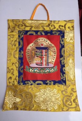 This handmade silk brocade Kalachakra wall hanging from Nepal features a lotus design, serving as a spiritual reminder of the profound teachings of Tibetan Buddhism.