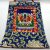 This handmade Medicine Buddha thangka from Nepal, adorned with silk brocade, invites healing and serves as a spiritual focal point for your sacred space.