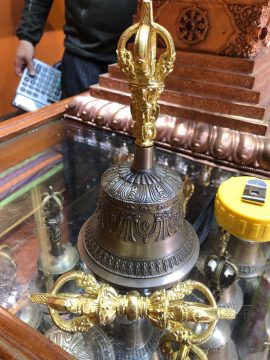The 5 Pronged Bell and Dorje Set, handmade by skilled artisans in Nepal, symbolizes the union of method and wisdom, enhancing meditation and rituals within Tibetan Buddhism.