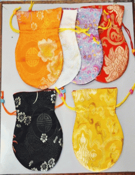 Handmade in Nepal by skilled artisans, these silk brocade mala bags protect your mala's spiritual essence and serve multiple purposes on your sacred journey.