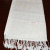 This handmade meditation shawl, crafted in Nepal by skilled artisans, envelops the practitioner in warmth, fostering tranquility and focus during spiritual practice. A gentle companion for your journey within.