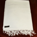 This handmade meditation shawl from Nepal, crafted with 70% Pashmina and 30% silk, offers warmth and comfort, supporting your spiritual journey during meditation and beyond.