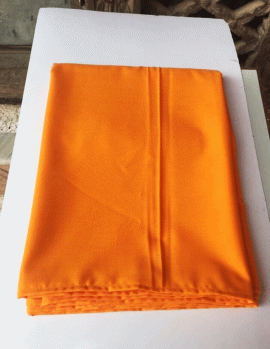 The Tibetan Yellow/Orange Cotton Meditation Shawl, handmade in Nepal by skilled artisans, offers warmth and tranquility, enhancing your meditation practice with its vibrant hues and comforting embrace.