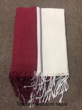 This handmade Ngakpa shawl, crafted by skilled artisans in Nepal, embodies the essence of Vajrayana Buddhism, offering a sacred tool for meditation and spiritual practice.