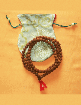 Rudraksha beads, sacred to Lord Shiva, are handmade in Nepal by skilled artisans. This mala serves as a powerful tool for meditation and spiritual growth.