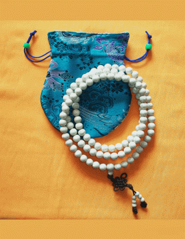 Handmade in Nepal by skilled artisans, this mala of 108 lotus seed beads symbolizes purity and spiritual awakening, embodying the essence of enlightenment rising from worldly existence.