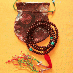 Handmade in Nepal by skilled artisans, this Rosewood mala features turquoise marker beads, enriching your spiritual practice and enhancing your connection to positive energies.
