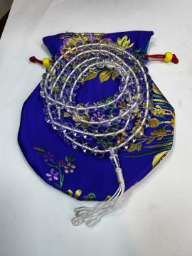 Handmade in Nepal by skilled artisans, this clear crystal mala features 108 beads, serving as a sacred tool for mantra recitation and meditation, enriching your spiritual practice.