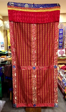 This traditional Tibetan Buddhist door curtain, handmade in Nepal by skilled artisans, enriches your space with its cultural significance and symbolizes protection and harmony.