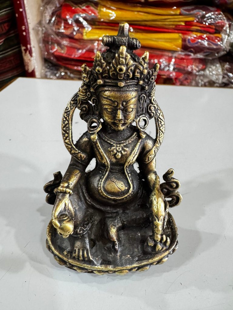 Copper and Brass Zambala Statue with Antique Finish
